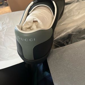 Gucci black leather tennis shoes. New with box and bag